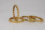 Emerald-studded Gold Bangles