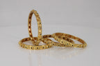 Emerald-studded Gold Bangles